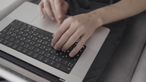 person typing on laptop keyboard