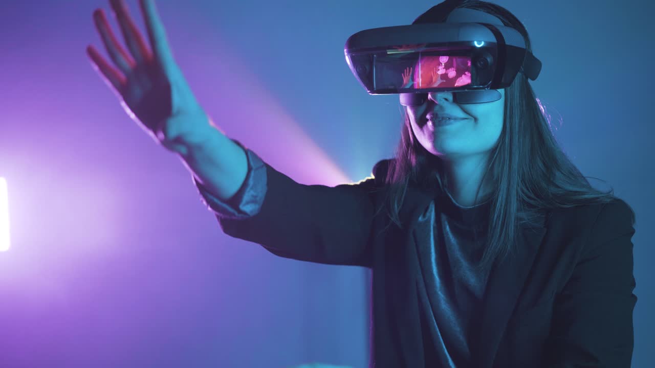 Anonymous woman in VR goggles in neon light