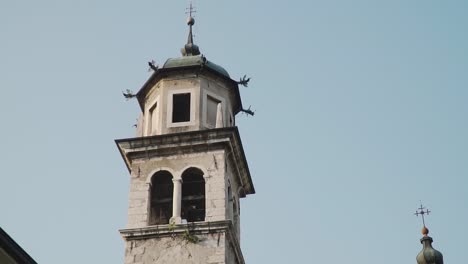 Bell-Tower-of-Inviolata-Church,-Riva-del-Garda-City,-Italy,-Close-Up-Detail-Slow-Motion