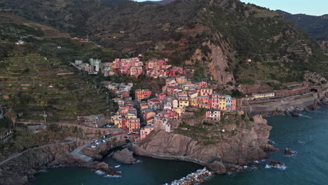 picturesque aerial shot of colorful manarola, cinque terre along the rugged coastline
