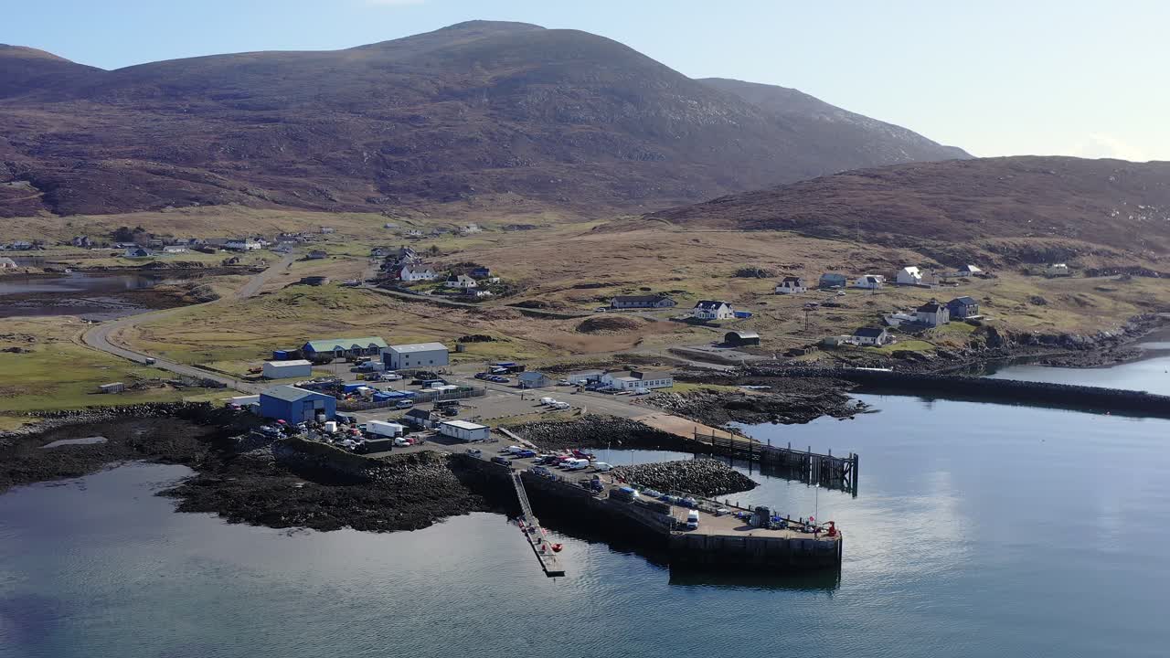 Drone shot of coastal Leverburgh and the surrounding moorland hills on Harris