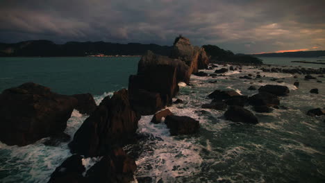 drone view of hashigui iwa rocks at sunset, wakayama japan