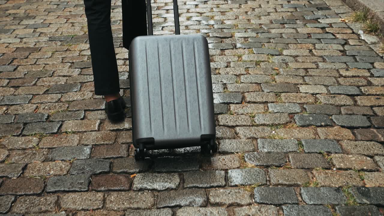 Tourist man with suitcase baggage in spain, A traveler with luggage suit jacket on business street go to a hotel, business office, airport terminal, enjoying the vibrant atmosphere