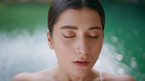 yoga woman inhaling practises meditating tropic lagoon close up. lady breathing