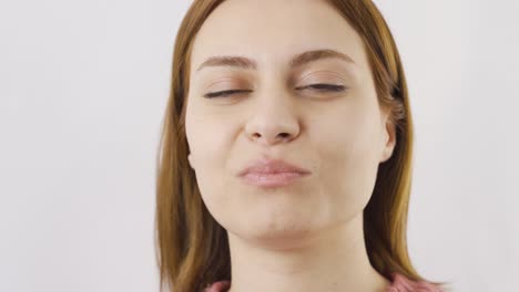 close-up portrait of woman chewing gum.