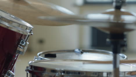 black man practicing drums in studio