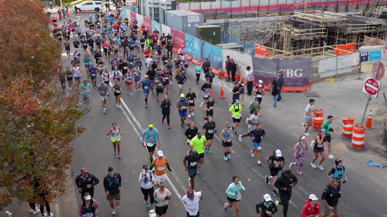 High angle view of street full of people running during a marathon race