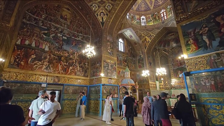Tourists Visiting the Ornate Interior of Vank Cathedral in Isfahan