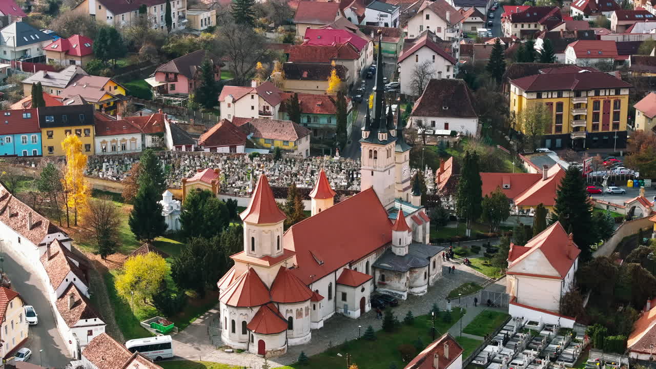 Aerial drone view of the St. Nicholas Church near a cemetery in Brasov, Romania