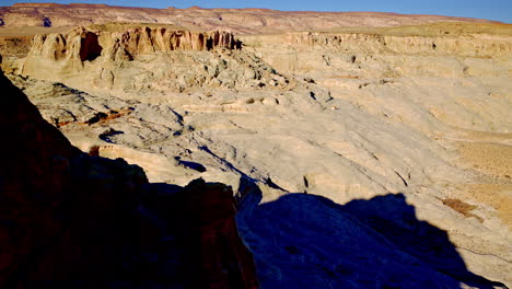 dramatic done shot starting behind mountain flying to reveal fantastic rocks of all shapes and colors