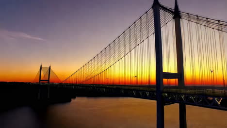 vibrant sunset over a cable-stayed bridge