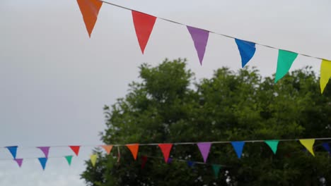 medium close-up of celebratory bunting blowing in the wind