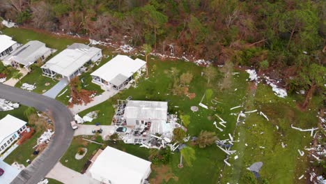 4k drone video of debris in pine trees from homes destroyed by hurricane ian in north port, florida - 21