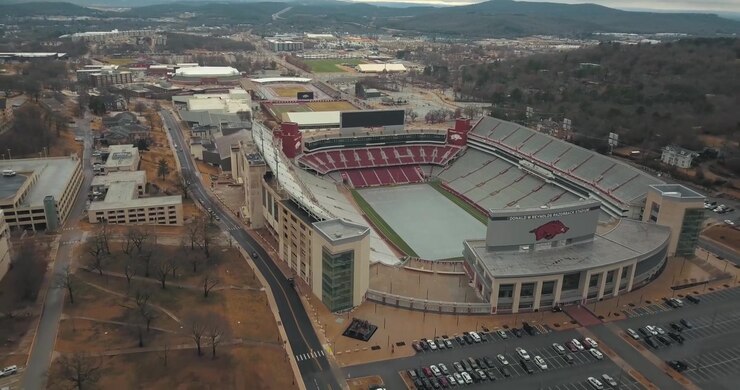 This shot is a cinematic aerial clip of the University of Arkansas football stadium.