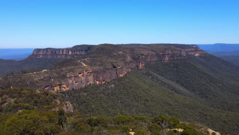 dramatic aerial drone view of blue mountains and clear blue sky in new south wales