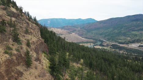 spectacular aerial scene of rocky mountains covered with evergreen vegetation in the south thompson river valley close to kamloops bc canada