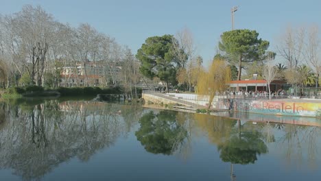 city heritage travel people noon sunny portugal tomar river water bridge terrace promenade street nabao shoulder shot