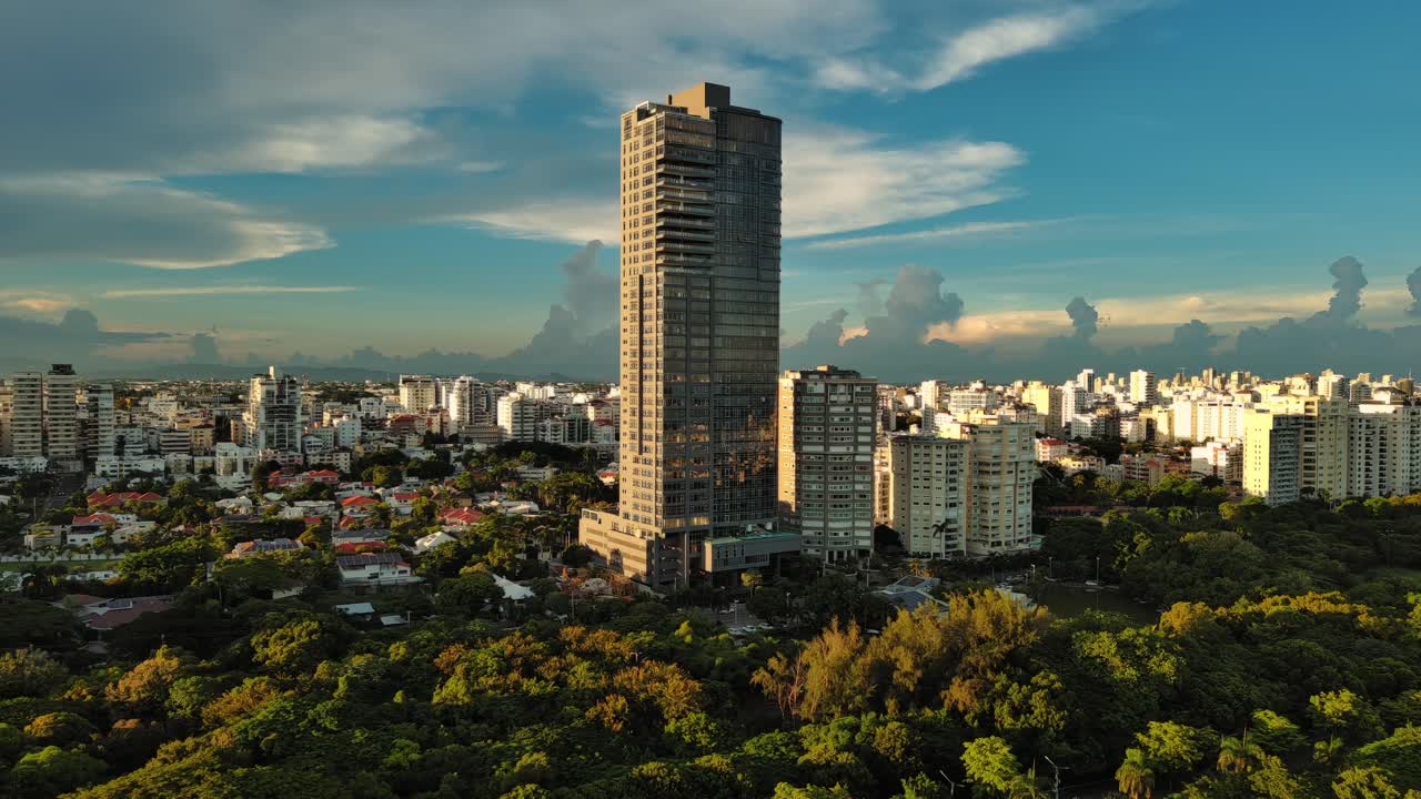 Anacaona 27 tower skyscraper, Mirador Sur. Santo Domingo in Dominican Republic. Aerial drone lateral view