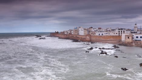 wide angle view from elevated position of the walled castle city of essaouira, morocco on a stormy day