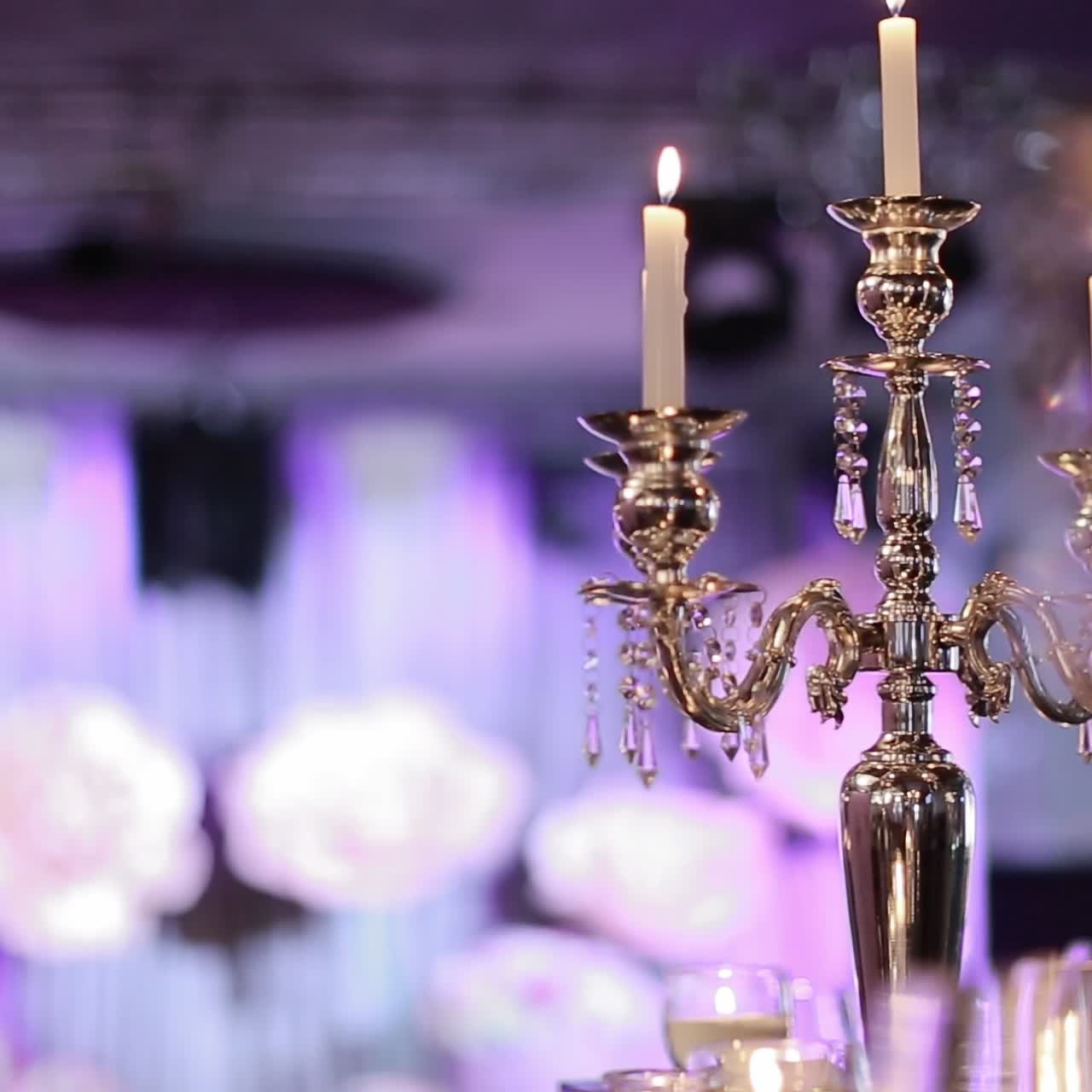 Decorative candles burning on a banquet table