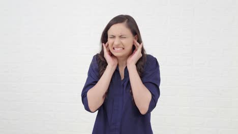 indian girl disturbed by loud noises
