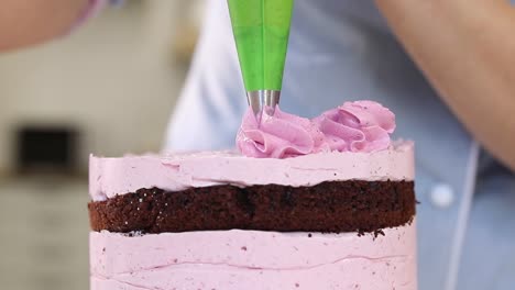 beautiful layered cake with pink frosting