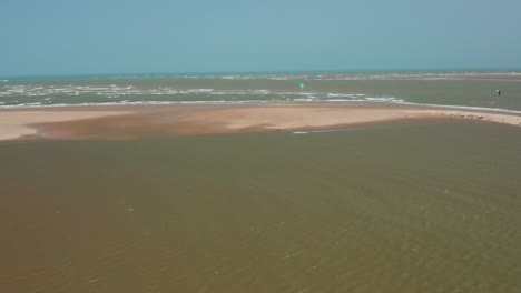 Aerial:-Kitesurfing-in-the-river-delta-of-Parnaiba,-Northern-Brazil