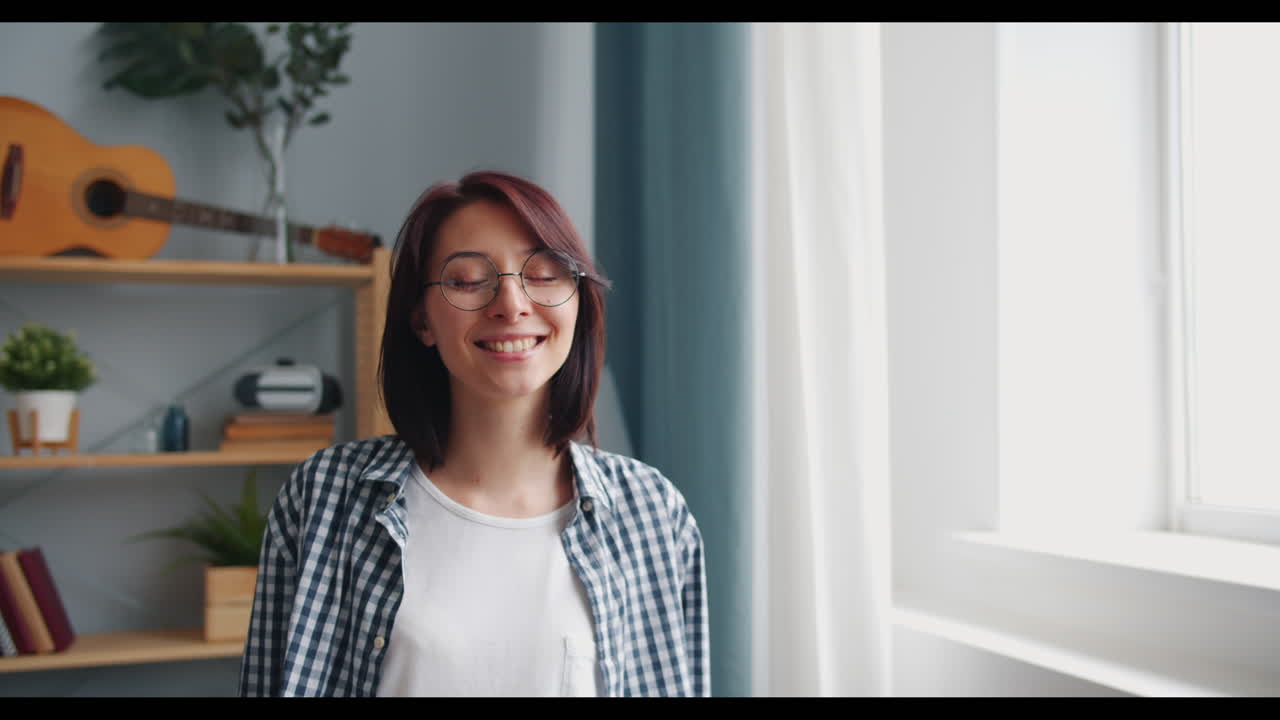 Smiling Woman with Glasses in a Home Interior