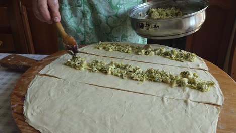 Grandmother-Spooning-Filling-onto-Pie-Dough---A-Heartwarming-Tradition-of-Culinary-Craft-Heritage