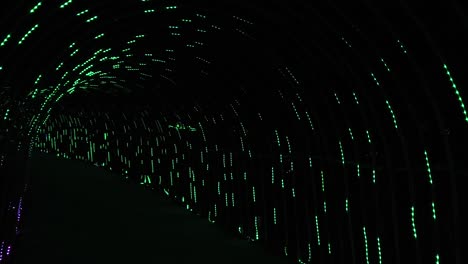 led lighting festival in the park walking through led tunnel – slow mo