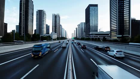 Dynamic cityscape video with a low-angle view of a bustling highway, showcasing modern skyscrapers