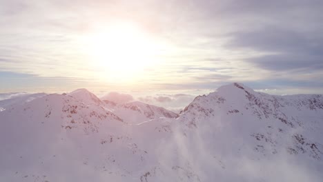 snowy mountain peaks at sunrise/sunset