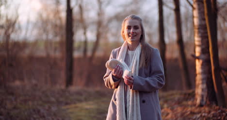 Woman-Warming-Up-Hands-In-Autumn-4