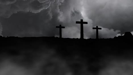 silhouette of three crosses against storm clouds background