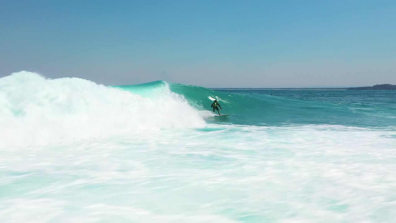Surfer Rides Big Ocean Barrel Wave at Jervis Bay, Australia. Water Sport Aerial Shot