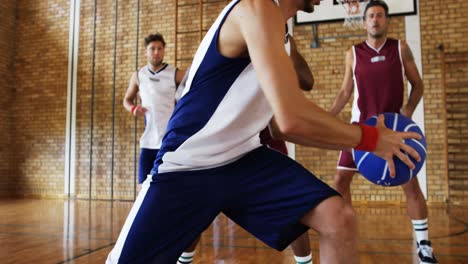 Basketball-players-playing-in-the-court