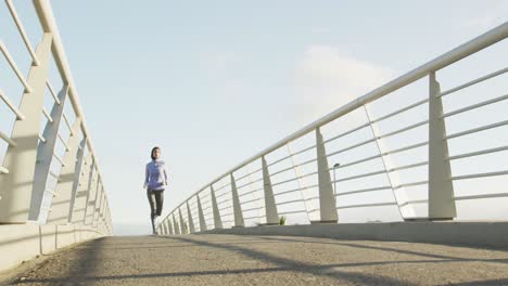 Woman-wearing-hijab-running-outside-