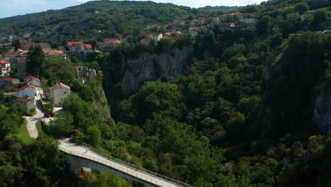 bridge over pazin cave with houses on cliffside in pazin, istria, croatia