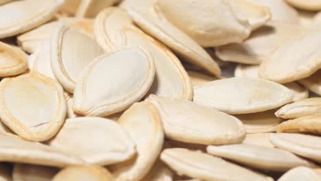 macro photography lots of roasted pumpkin seeds macro photography lots of roasted pumpkin seeds slow motion healthy food