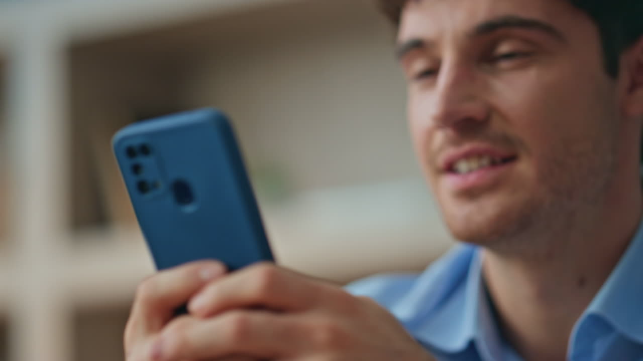 Cheerful employee browsing banking app cellphone satisfied in office close up.