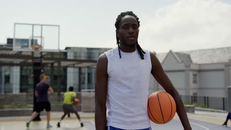 basketball player standing with basketball 4k