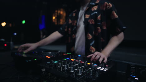 a dj mixing music at a nightclub