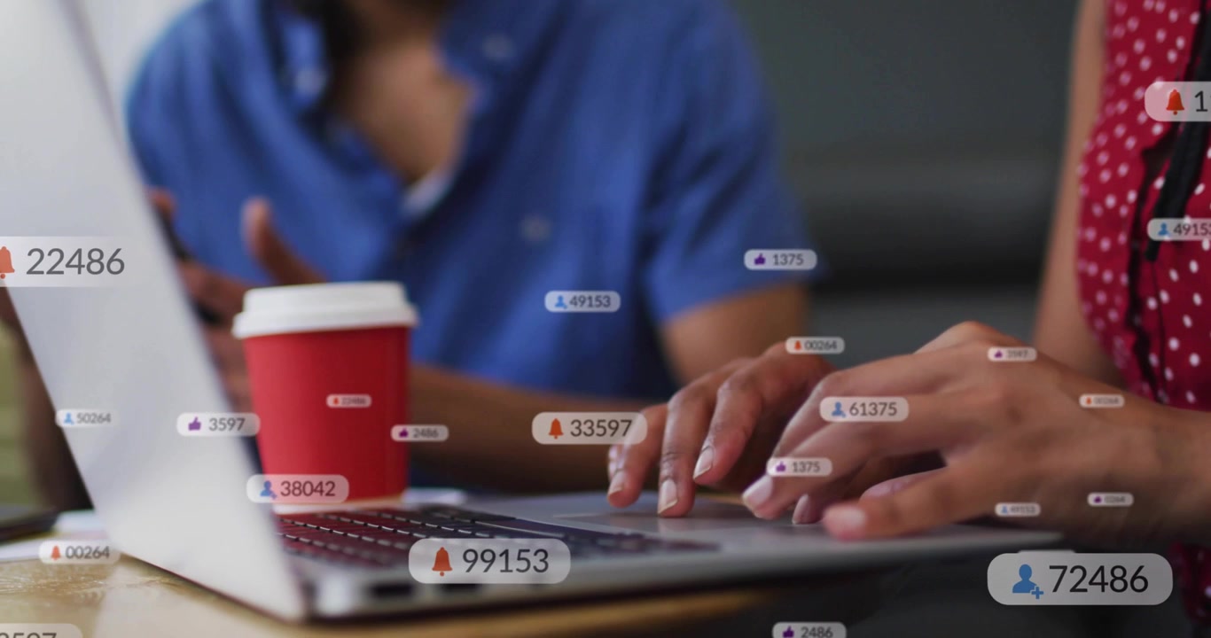 Woman typing on laptop, causing alerts popping around hands, showing rising marketing metrics
