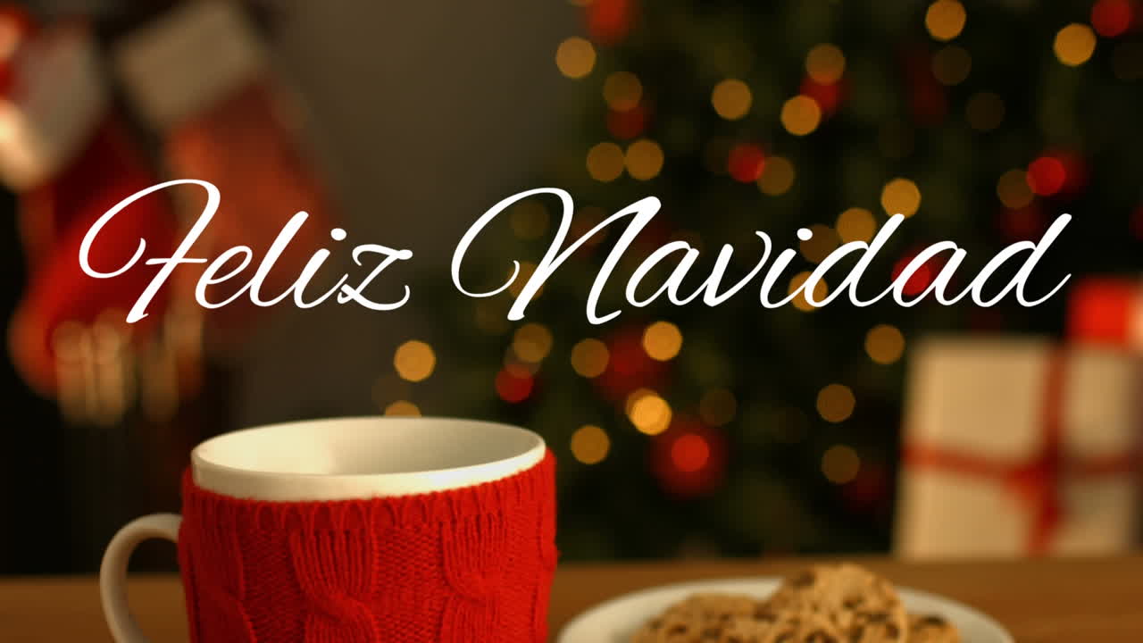 feliz navidad escrito sobre taza y plato con galletas