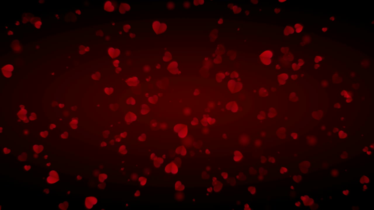 los corazones de amor están cayendo lentamente sobre un fondo oscuro, especialmente para el día de san valentín y el 8 de marzo.