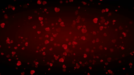 los corazones de amor están cayendo lentamente sobre un fondo oscuro, especialmente para el día de san valentín y el 8 de marzo.