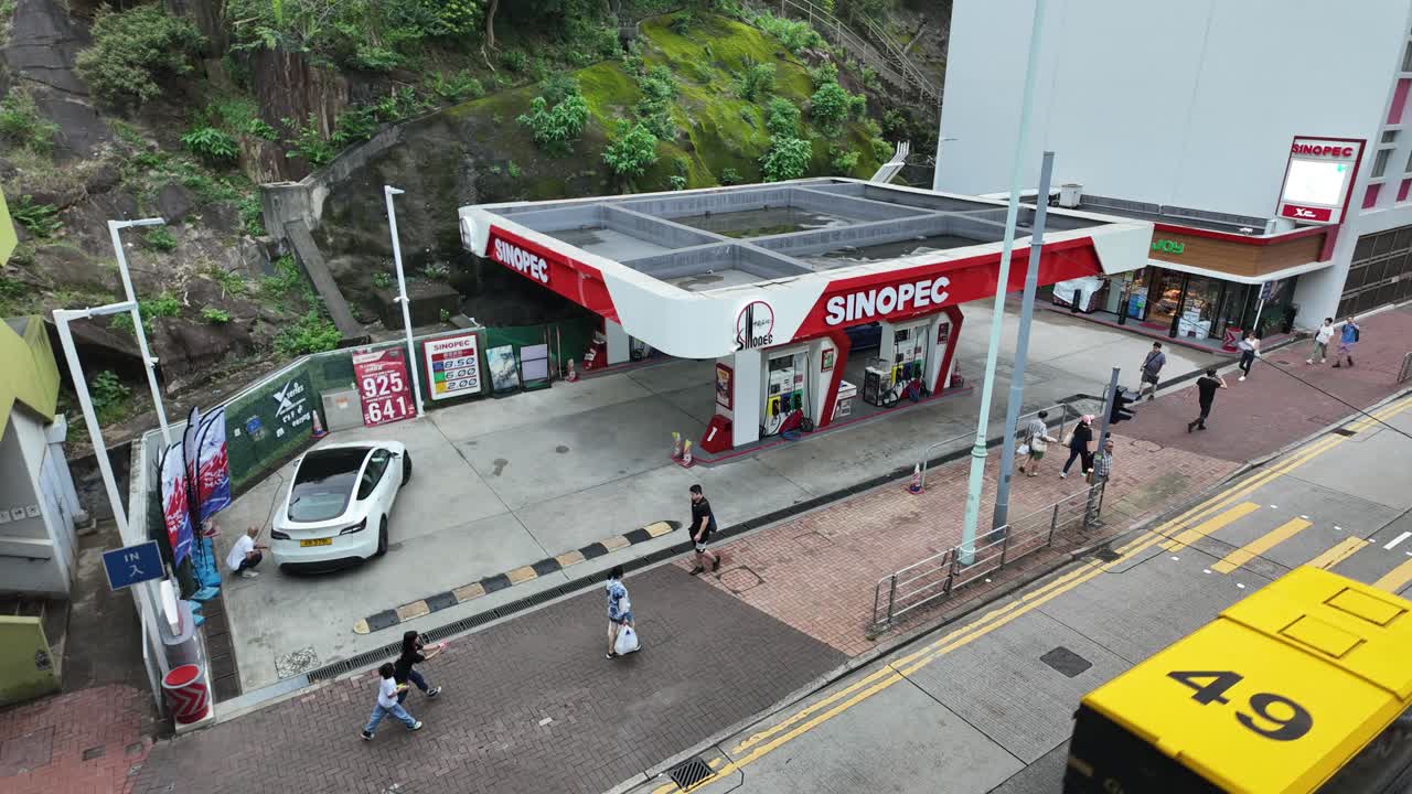 Timelapse view of the Sinopec gas station in Quarry Bay, Hong Kong, highlighting urban landscape and energy infrastructure.