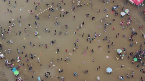 Aerial-view-of-people-flying-small-kites-at-Sumpango-Kite-Festival,-guatemala