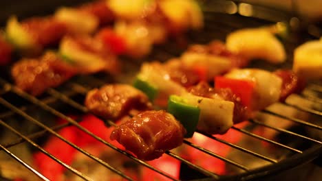 grilled kebabs cooking on a fiery barbecue