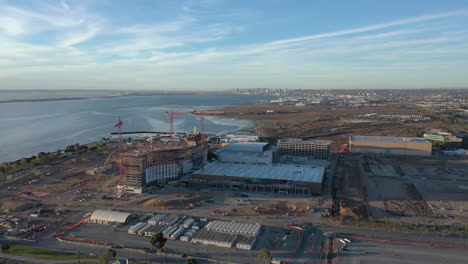 The-new-convention-center-being-build-in-Chula-Vista-California,-with-San-Diego-skyline-in-the-distance